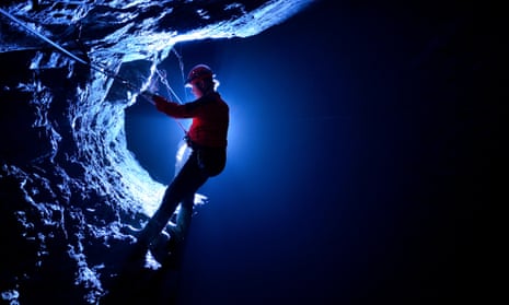 A visitor to Zip Below Xtreme uses via ferrata cables deep below Snowdonia