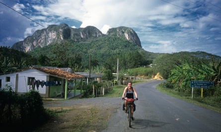 Girl cycle touring in Vinales region of Cuba