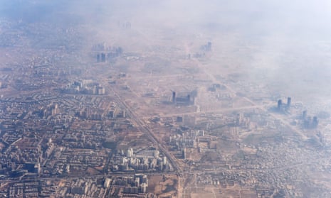 A pall of smog drifts across buildings on the outskirts of Delhi.