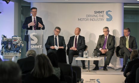 Mike Hawes, left, chief executive of the Society of Motor Manufacturers & Traders (SMMT), speaks as car industry executives, from left, BMW Group UK Managing Director Graeme Grieve, Jaguar Land Rover UK Managing Director Jeremy Hicks, Volkswagen Group UK Managing Director Paul Willis and Ford of Britain Chairman and Managing Director Mark Ovenden, look on during the launch of UK nationwide consumer campaign, promoting diesel technology in central London, March 11, 2015.