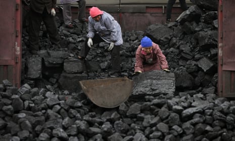 Workers load coal in Tangxian in China's Hebei province. Chinese companies topped a list of owners of the least efficient 'sub-critical' coal power plants globally.