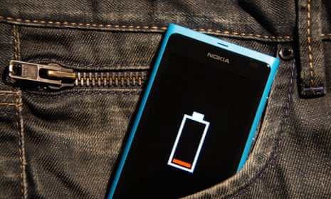 A phone with low battery in a jeans pocket.
