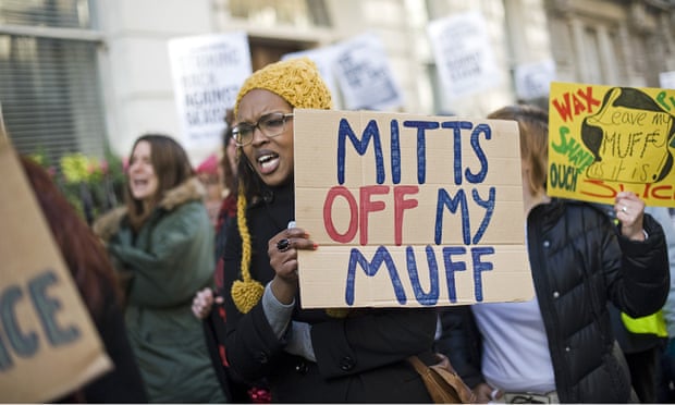 Campaigner with 'mitts off my muff' placard