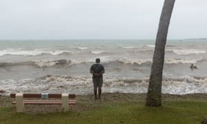 A man looks out to sea on Anse Vata beach, Nouméa, New Caledonia. Unlike Vanautu, 500km to the east, Cyclone Pam had little effect on Noumea