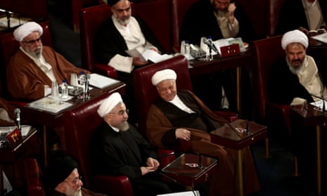 Hassan Rouhani, Iran's president, sits with the country's ruling body the Assembly of Experts
