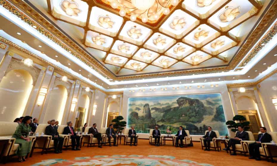 China's President Xi Jinping meets with guests at the Asian Infrastructure Investment Bank (AIIB) launch ceremony at the Great Hall of the People in Beijing in October 2014.