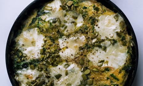 Nigel Slater's baked eggs with taleggio and greens in a skillet