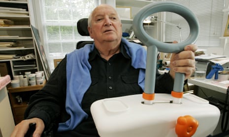 Michael Graves with the bathtub handle he designed to help handicapped and elderly people.