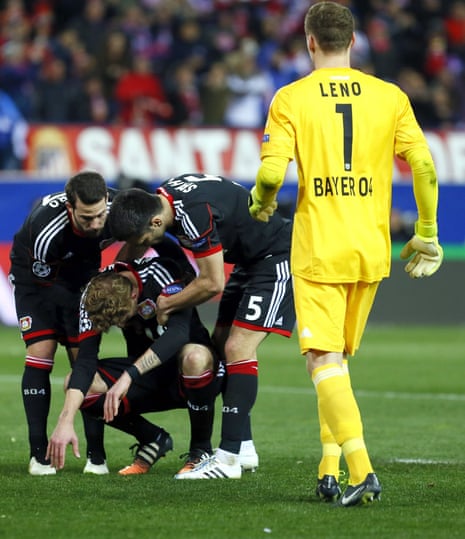 Bayer Leverkusen players try to console Stefan Kiessling after he missed the deciding penalty