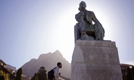 A student walks past a statue of British colonialist Cecil John Rhodes at the University of Cape Town.