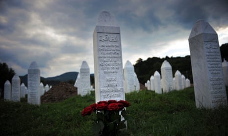 Flowers are seen at a grave in the Potocari memorial cemetery near Srebrenica.