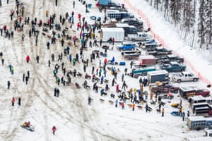 Teams line up in the staging area before the official start of the race in Fairbanks, Alaska. 