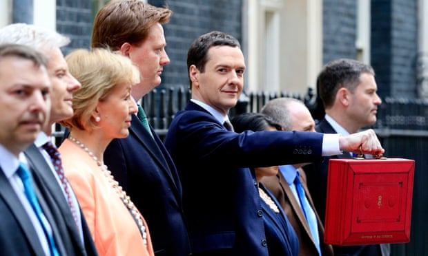 Chancellor of the Exchequer George Osborne stands with his Treasury team outside 11 Downing Street, London, before heading to the House of Commons to deliver his annual Budget statement.