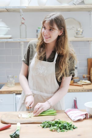 a lady making falafel