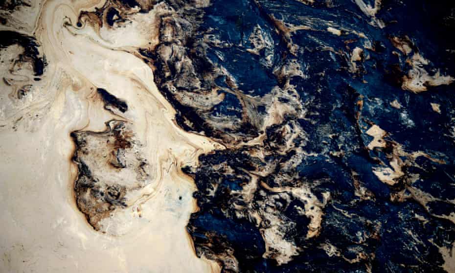 Toxic waste at an oil excavation mine in Alberta, Canada. A Guardian campaign backed by 95,000 people so far is asking the Gates to sell their fossil fuel investments.