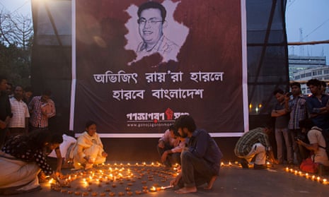 Activists light lamps in protest against the killing of Avijit Roy in Dhaka, Bangladesh
