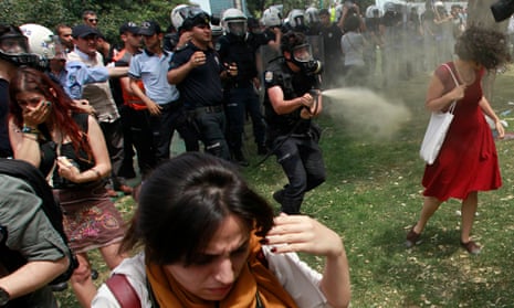 Turkish riot policeman uses tear gas against protesters