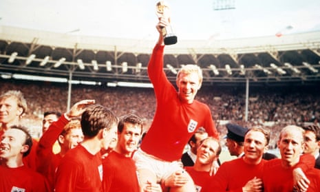 England's captain Bobby Moore holds aloft the Jules Rimet World Cup trophy at Wembley, London, 30 July 1966.