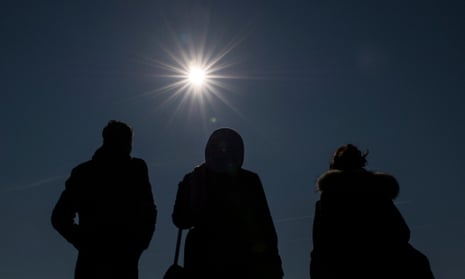 Spectators watch the solar eclipse.