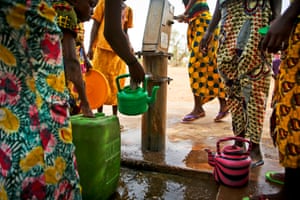  Children queue to collect clean water in the Malian village of Diatoula, 15km outside of Bamako, which has more than 1,000 inhabitants. As many as 4.9 million people, more than a third of the population, lack safe water. The situation for sanitation is worse at 75%