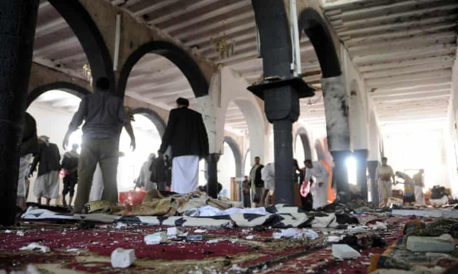 People clear up a mosque that was the scene of a suicide attack in Sana’a on Friday.