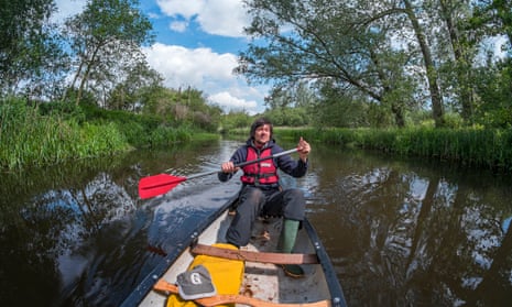Coastlines author Patrick Barkham canoeing on the river Bure, Norfolk. 