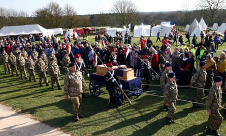 Cadets wheel Richard III's coffin on to the battefield at Bosworth.