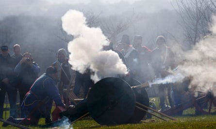 Reenactors fire a canon during a salute to Richard III during a ceremony in the presence of his remains at the site of the Battle of Bosworth,