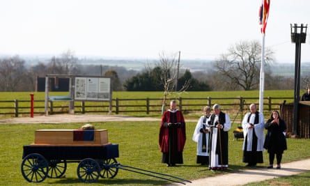 Members of the clergy hold a religious service in the presence of Richard III's coffin on the battefield at Bosworth