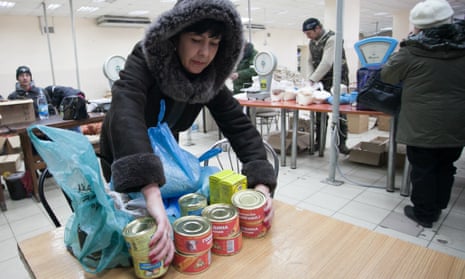 Local residents receive humanitarian aid in the city of Debaltseve, Ukraine.