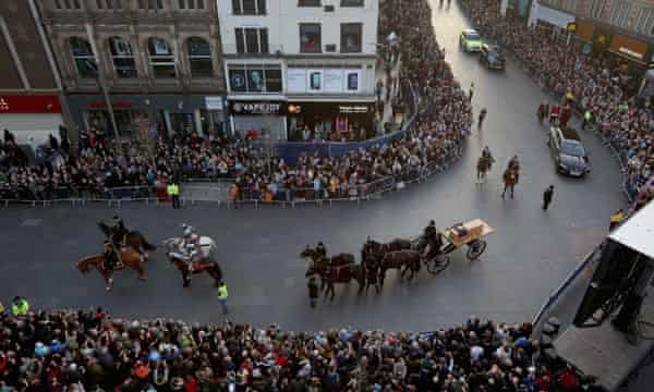 The coffin containing the remains of King Richard III is carried in procession.