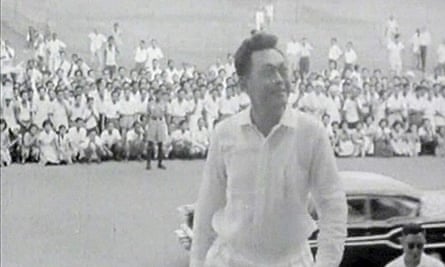 Lee Kuan Yew climbing up the steps at the city council chambers following the People's Action party's win in the national elections in Singapore in 1959, the year the country achieved independence.