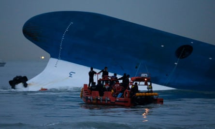 Maritime police search for missing passengers by the Sewol ferry, South Korea.