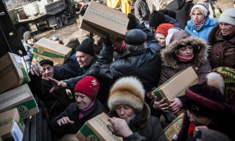 Russian backed rebels hand out boxes of food to civilians on February 25, 2015 in Debaltseve, Ukraine. After approximately one month of fighting, Russian backed rebels successfully forced Russian backed rebels hand out boxes of food to civilians in the town of Debaltseve from which Ukrianian troops withdrew in February.