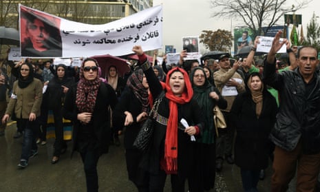 Afghan protesters hold banners as they protest the killing of Afghan woman Farkhunda.