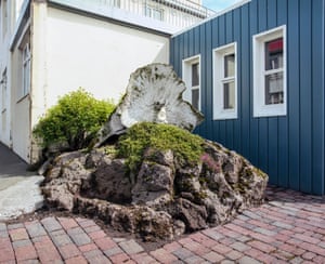 Vesturbraut, Hafnarfjörður: A lava rock between two houses in Vesturbraut, a street in Hafnarfjörður where ‘hidden people’ are believed to reside. The residents at Vesturbraut have made a feature of it, despite being sceptical about the existence of the creatures.