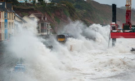 Stormy weather brings waves crashing over trains at Dawlish,