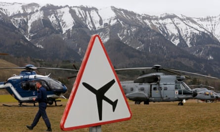 Rescue helicopters mount an operation near to the crash site of an Airbus A320 in the French Alps.
