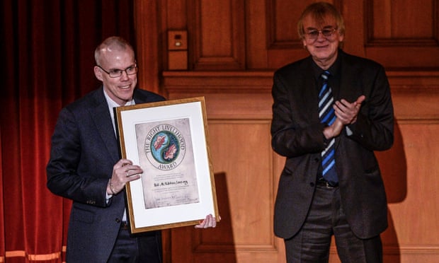 Bill McKibben (L) representing the organization 350.org of the U.S. receives the Right Livelihood Award from Jakob von Uexkull during the Right Livelihood Award ceremony at the second chamber hall at the Swedish Parliament in Stockholm December 1, 2014. McKibben receives the award for "mobilizing growing popular support in the USA and around the world for strong action to counter the threat of global climate change."