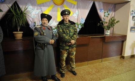 Pro-Russian militants stand guard at a polling station in eastern Ukrainian during controversial leadership elections that Kiev and the west have refused to recognise.