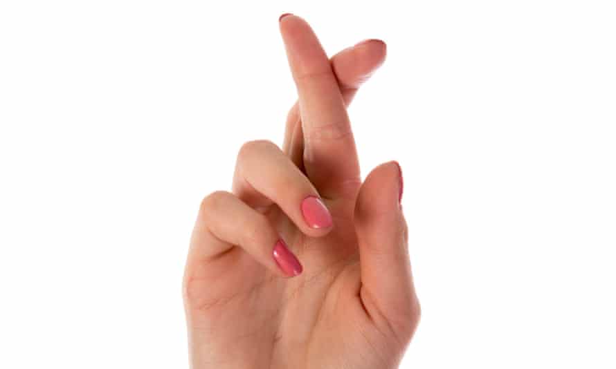 Crossing your fingers might reduce pain, says study | Science | The Guardian