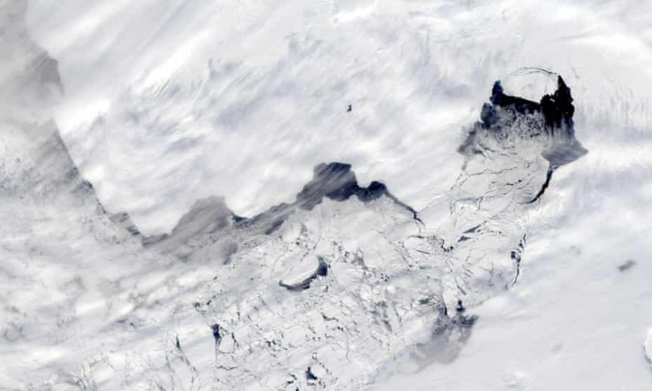 a large iceberg separated from the calving front of Antarctica’s Pine Island Glacier