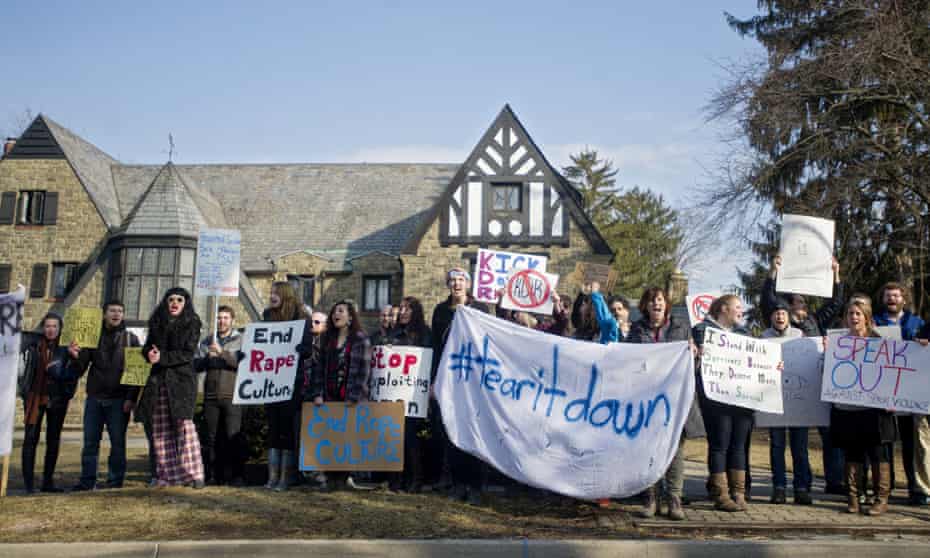 Protesters gather outside the Kappa Delta Rho fraternity house in State College, Pennsylvania.