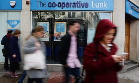 The Co-op Bank has halved annual losses.