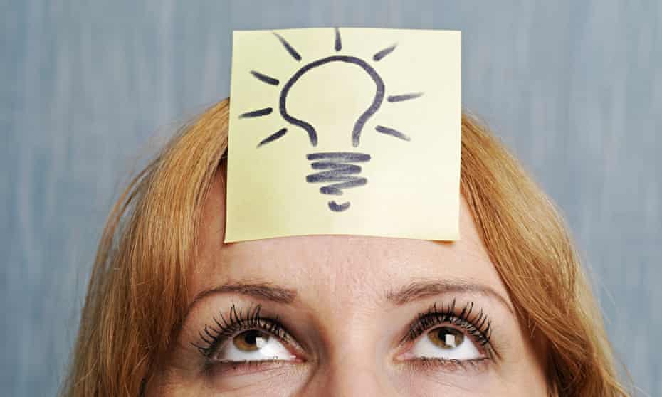 Woman with a drawing of a lightbulb on her head 
