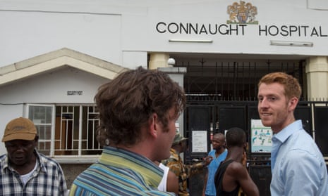  Dr. Colin Brown, chats with Dr. Oliver Johnson, with UK   based King's Health Partner, at right, outside Connaught Hospital in Freetown, Sierra Leone, on Tuesday, November 18, 2014.
