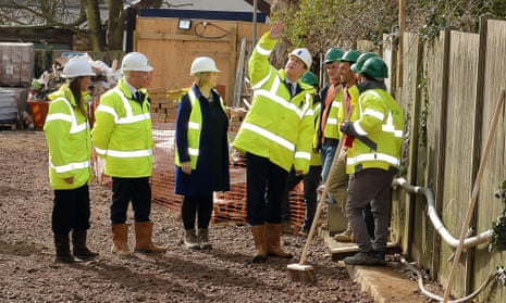 Prime Minister David Cameron talks to a group of construction workers.