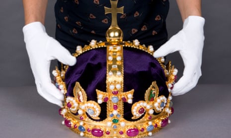 Henry VIII's crown, held by a curator at the Tower of London