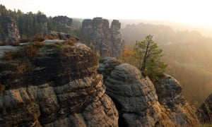 22 Oct 2013, Germany --- The sun rises above Saxon Switzerland near Rathen, Germany, 22 October 2013. Photo: Sebastian Kahnert/ZB --- Image by   Sebastian Kahnert/dpa/CorbisautumnCentral EuropeEuropegeographyGermanynatural worldrockSaxonysciencesseasonstourismtravelweather