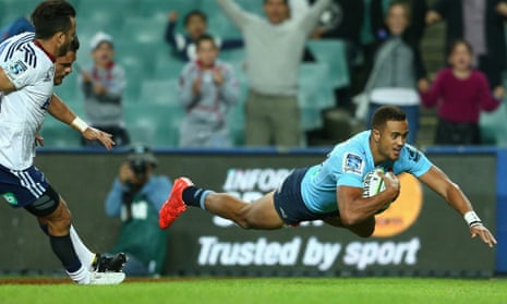 Peter Betham dives over the try line for the Waratahs during Saturday's game against the Blues